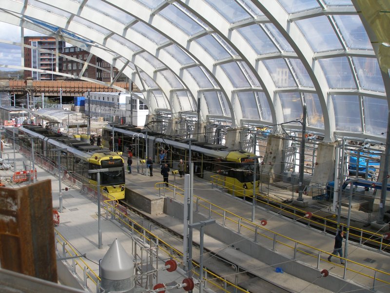 Manchester Victoria Railway Station 11 April 2015 on the occasion of a guided tour organised by the Lancashire & Yorkshire Railway Society: trams pass at the new tram stop. A third track is out of sight at the bottom of the picture, awaiting to be commissioned when the second cross-city line opens.