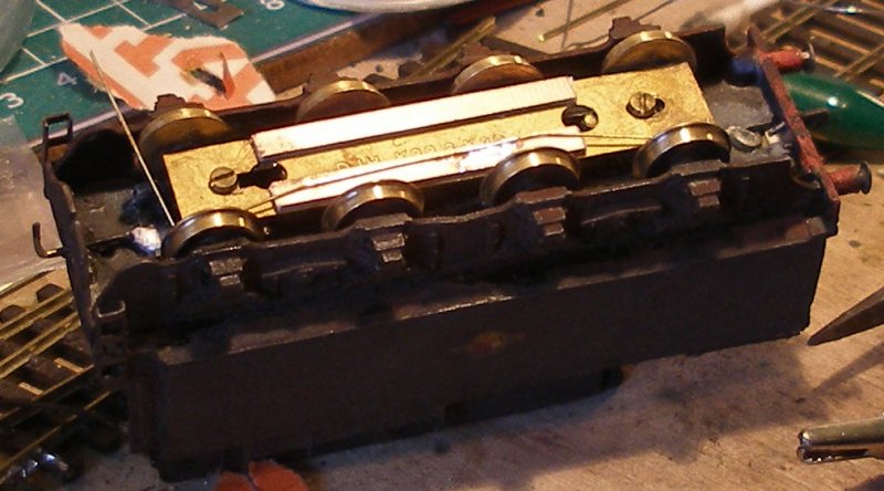 Fitting extra pick-ups to a DJH WD 2-8-0 tender: The first pick-up is formed from Alan Gibson handrail wire, and soldered to the copper paxolin. Note how this rubs on the first and fourth wheels.