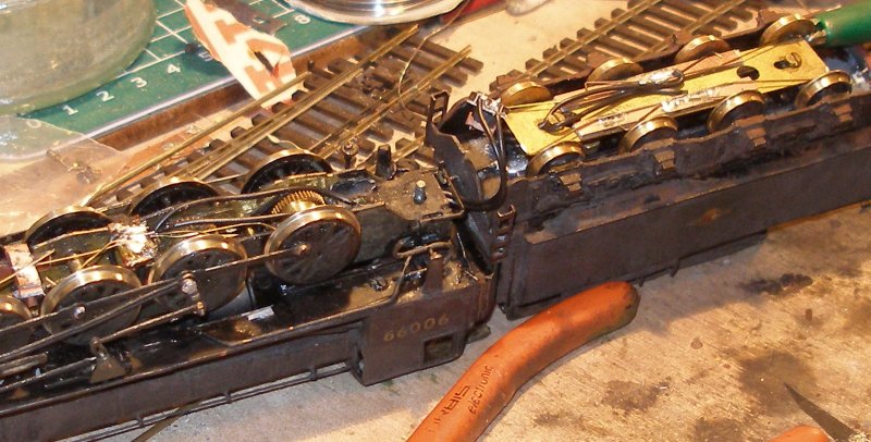 Fitting extra pick-ups to a DJH WD 2-8-0 tender: Finally, the loco and tender are coupled back together, and the plug and socket connected. Before leaving the work bench, the loco was checked for any shorts. This was where it was discovered there was a piece of copper connecting the two pins on the slice of blanking plug.