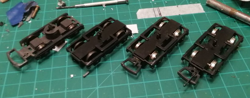 4mm OO DMU bogies, left to right, Lima, Dapol with Romford wheels, and Dapol with original wheels