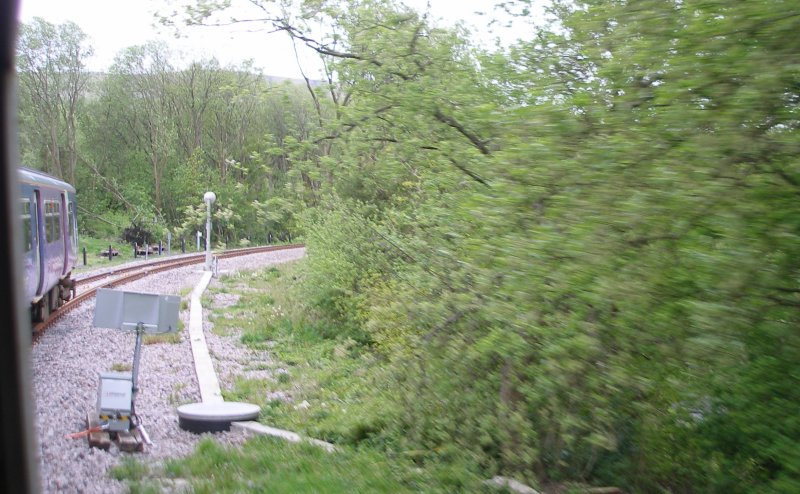 First train enters the Todmodern curve from Stansfield Hall Junction