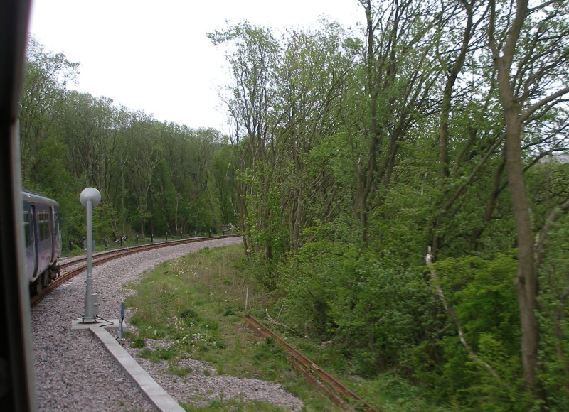 First train enters the Todmodern curve from Stansfield Hall Junction