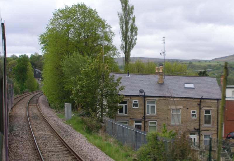 First train approaches the Todmodern curve from Copy Pit